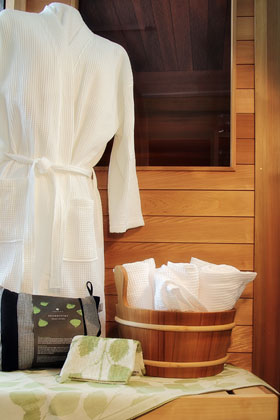 collection of sauna robe and towels
