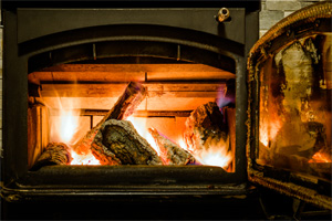 fire in wood stove with open door