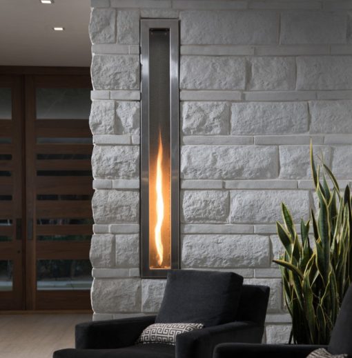 Helifire 360 columnar fireplace in a atone clad wall