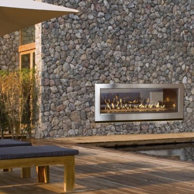 54" Outdoor linear gas fireplaces in stone wall